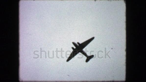 1940 clip of World War 2 plane flying silhouette.