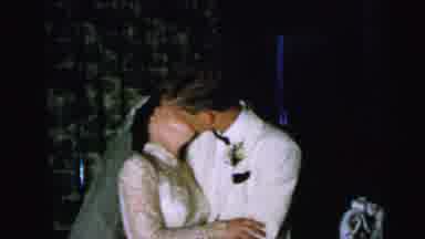 CAMDEN NEW JERSEY USA-1964: Young Newly Married Couple In Wedding Gown And Tuxedo Kissing